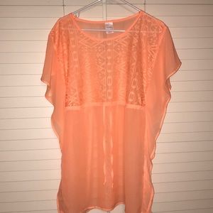 Bright orange swim cover up with Aztec patterns